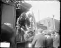 Republican presidential nominee Charles Evans Hughes, and his wife shake hands with supporters at Chicago's Union Station during his 1916 United States presidential campaign