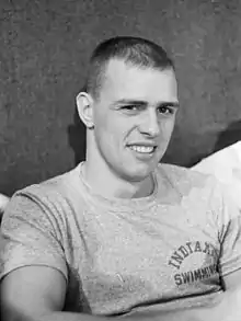 Crew cut: top, short; back/sides, semi-short taper; sideburns, short; short pomp (pompadour) front, flattened; mid top, flattened; crown, rounded; front hairline, average; wavy hair.