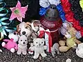 Children's toys placed by the site of the barn where an estimated 149 people were burned to death.