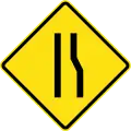 Road narrows ahead on right side