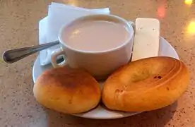 "Chocolate santafereño" (Santafe hot chocolate), almojábana, cheese and pandebono