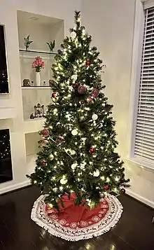 Christmas tree decorated with ribbons, stars and glass balls