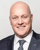 Smiling bald white man in suit