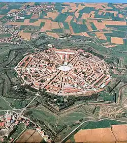 Image 18Palmanova, Italy, constructed in 1593 according to the defensive ideal of the star fort, today retains its distinctive geometry. (from History of cities)
