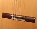Timber hitches on the bridge of a classical guitar