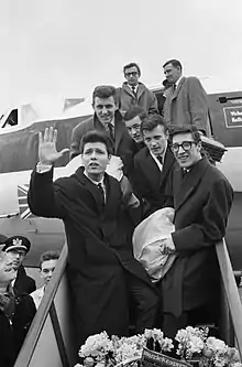 Cliff Richard (bottom left) and the Shadows in 1962, anticlockwise from right: Hank Marvin, Jet Harris, Brian Bennett, and Bruce Welch.
