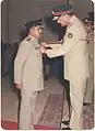 Colonel Salman Ahmed, great grandson of Shaykh Altaf Hussain 19th in direct descent from Amir Kulal being awarded Sitara-e-Basalat by the Vice Chief of Army Staff at Rawalpindi, 1985