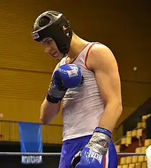 A young competitor executing the savate salute