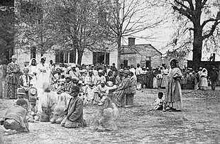 A contraband camp, formerly used as a female seminary, circa 1863.