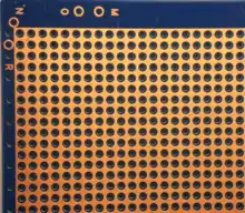 Bottom of a copper clad Perfboard with a ground plane