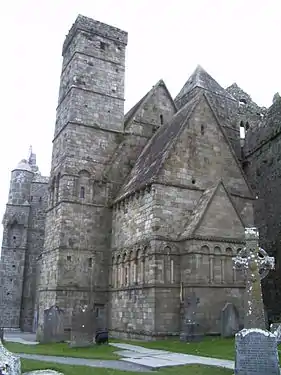 Cormac's Chapel, Rock of Cashel, Ireland, with its steeply pitched roof and bands of blind arcading maintains a distinctly Irish character.