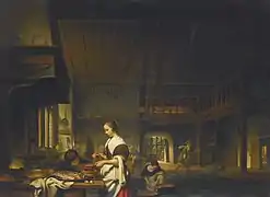 Kitchen interior with a woman cooking and a boy blowing flames