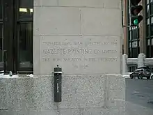 Photograph of building's cornerstone
