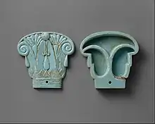 Cosmetic box in the shape of an Egyptian composite capital, its cap being in the left side; 664–300&nbsp;BC; glassy faience; 8.5 × 9&nbsp;cm; Metropolitan Museum of Art