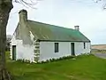 Derelict Cotter house by Croy church
