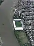 Aerial view of Craven Cottage and the adjacent Stevenage Road, Fulham, which was the location of two important events in Lamplugh's presumed abduction. Lamplugh's car was found abandoned towards the northern end of Stevenage Road, and it is also believed that she was sighted struggling with a man in a car driving south on the road by the south-east corner of the stadium.