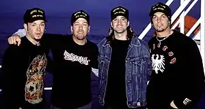 Creed in 2002. From left to right: then-touring bassist Brett Hestla, Scott Phillips, Scott Stapp and Mark Tremonti