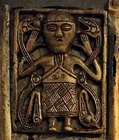 Figure on the upperam of Tully Lough Cross, 8th or 9th century, NMI
