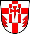 a cross enhanced - Argent; a cross enhanced gules, over all a billet charged with a cross pattée fitchée, all counterchanged and in base issuant from each flank a demi fir tree in pale gules - St. George's Church Pickering Village, Canada