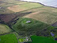 Aerial view of Cobbie Row's Castle and below, St Mary's Chapel