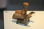 Cucuteni figurine staying on a miniature chair; 4750-4700 BC; ceramic; discovered at Târpești (modern-day Romania); Archaeology Museum Piatra Neamț