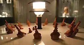 Cucuteni ritualic figurines sitting on miniature chairs; 4900-4750 BC; painted ceramic; Archaeology Museum Piatra Neamț (Piatra Neamț, Romania)