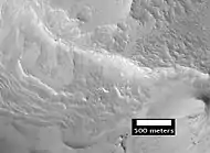 Close-up of layers in central mound of Curie Crater, as seen by HiRISE  Layers may have formed in a lake.