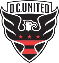 A shield with stylized black eagle facing right with three red stars and two red strips across its chest, and the words "D.C. UNITED" above.