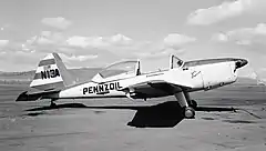 Grayscale photo of a monoplane.