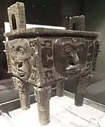 Da He ding (Chinese: 大禾方鼎; pinyin: Dà Hé fāngdǐng); Shang dynasty; Hunan Museum. This ritual bronze is one of the very rare vessels that is decorated with human faces