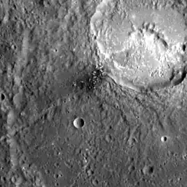 Detail of dark spot in Matisse crater.  Hollows are present in the dark spot and in the unnamed crater in upper right.