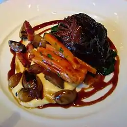 Daube of beef with lardons, carrots, and button mushrooms, served on parsnip puree