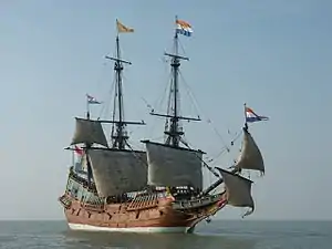 View of starboard side of three-masted sailing ship at sea with it's lower sails raised