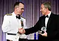 US Navy Admiral Mike Mullen (in optional white semi-formal mess dress uniform) congratulates former British Prime Minister Tony Blair at the Atlantic Council of the United States Distinguished Leadership Award Gala (2008)
