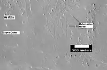 The group of lines running up and down in the image are believed to be deformation bands.  They can be thought of as small faults.