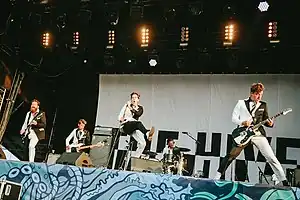 The Hives performing in 2018 L to R: Vigilante Carlstroem, The Johan and Only, Howlin' Pelle, Chris Dangerous, Nicholaus Arson