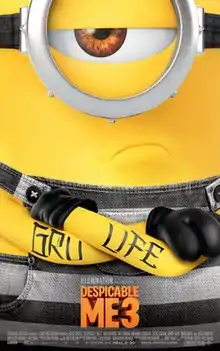 A yellow creature with one eye wearing black-and-white striped denim overalls, with a tattoo that reads "GRU LIFE" around his arms.