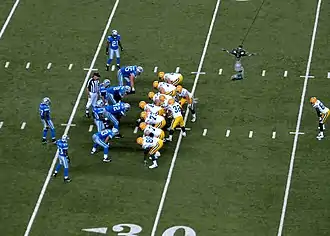 Brett Favre kneels at the end of the game