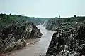 Downstream Narmada river flowing after the Dhuandhar Falls.