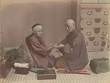 Image 29A doctor checks a patient's pulse in Meiji-era Japan. (from History of medicine)