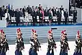 The French President traditionally welcomes honorary guests for the parade (here: Donald Trump in 2017)