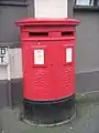 Modern Royal Mail branded EiiR Type C double aperture pillar box, Menai Bridge.
