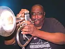 Dr. Ron Myers plays the flugelhorn at a 2013 performance in Roland, Oklahoma