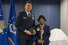 Air Force Space Commander presents Dr. Gladys West with an award as she is inducted into the Air Force Space and Missile Pioneers Hall of Fame for her GPS work on December 6, 2018.