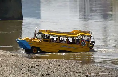 Image 8Duck tour converted DUKW amphibious vehicle exiting the River Thames.