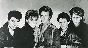 Duran Duran in 1983. Left to right: Roger Taylor (drums), Nick Rhodes (keyboards), Simon Le Bon (vocals), Andy Taylor (guitar), and John Taylor (bass)