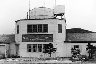 The building at Dutch Harbor airport used as communication room and terminal with the old U.S. Navy Aero Unit insignia in August 1972