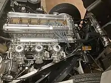 The straight-6 DOHC XK engine clearly sits behind the front axle of an FMR Jaguar E-Type