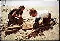 Two eighth grade students picking up the beach during recess, 1972