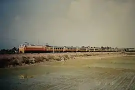 Dual-arm pantograph EMU100 with assisting locomotive